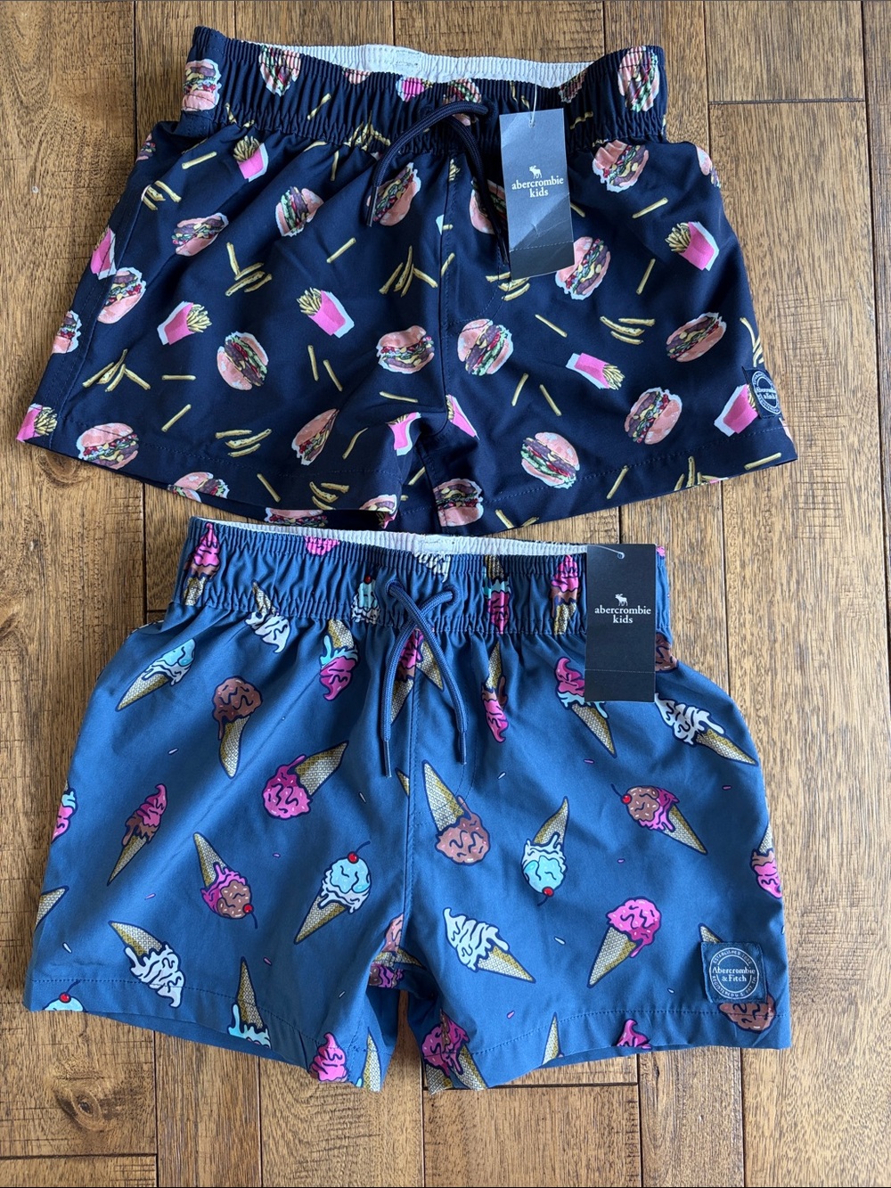 2 Pairs of abercrombie kids Navy Burger & Blue Ice Cream Print Swim Trunks